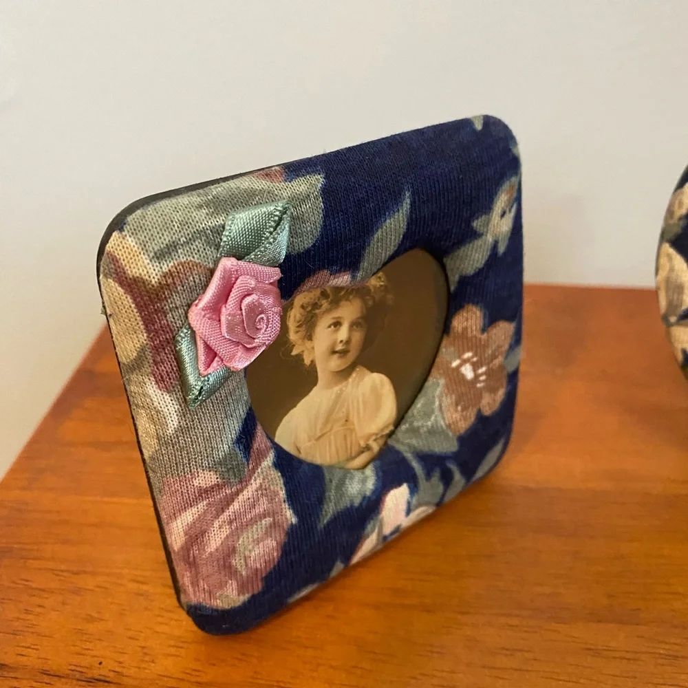 Two small fabric covered picture frames